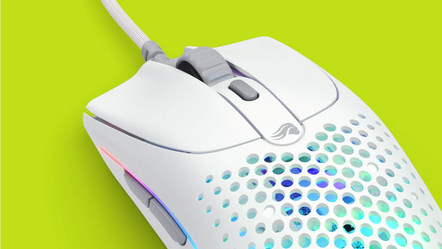 a white computer mouse with a hole in the middle