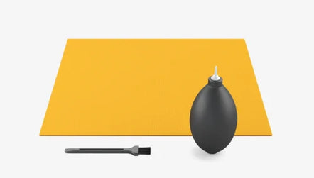 a black rubber pear and a brush