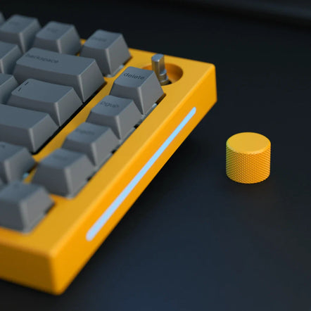 a yellow keyboard and a yellow knob