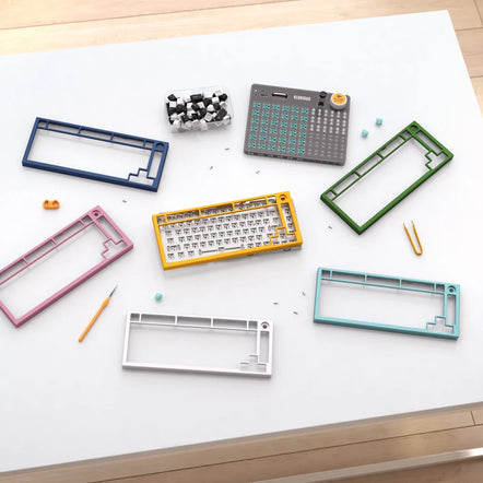 a group of colorful keyboard parts on a white surface