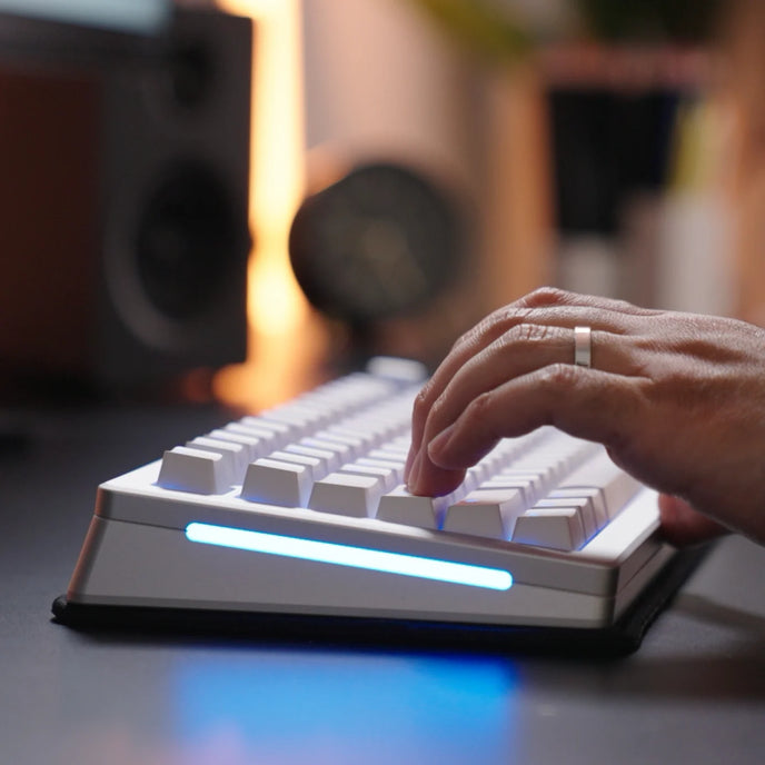 a hand on a keyboard