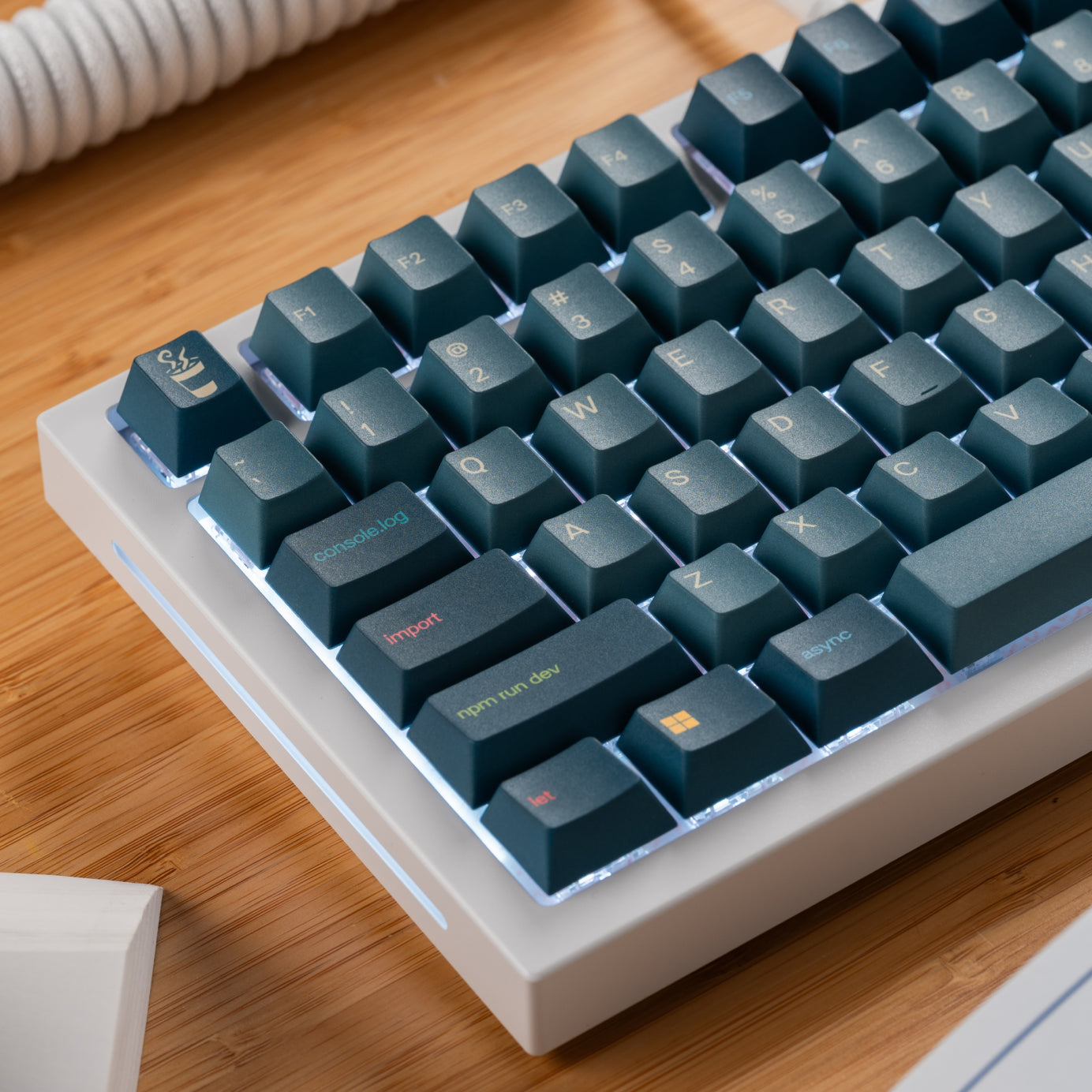 Close up of GPBT Code Brew keycap set on a white GMMK PRO keyboard, left side legends are visible