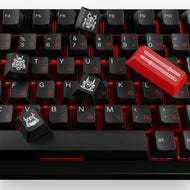 Close up of GPBT Kabuto keycaps with novelty keys scattered on top