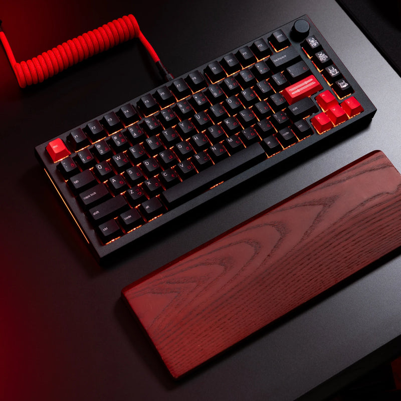 Desk setup featuring GPBT Kabuto Keycaps on a Black Slate GMMK PRO keyboard with red coiled cable and wooden wrist rest