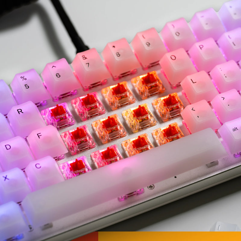 close up view of fox switches on a keyboard with the keycaps remove to reveal the switches