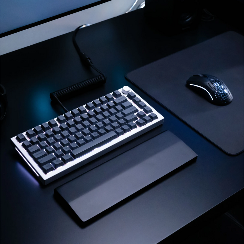 GPBT Black Ash keycaps on a GMMK PRO White Ice keyboard with a Phantom Black coiled cable in a black desk setup