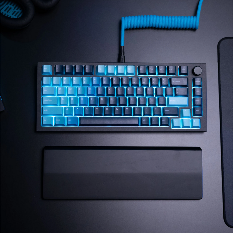 GPBT Celestial Ice keycaps on a Black Slate GMMK PRO keyboard with Electric Blue coiled cable in a black desk setup