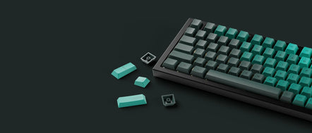 a keyboard and keys on a black surface