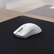 Model O 2 PRO 4K 8KHz Edition Mouse in White in a neutral desk setup