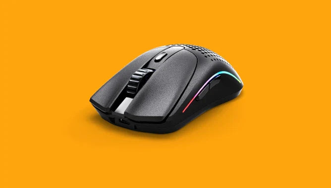 a black computer mouse on a yellow background