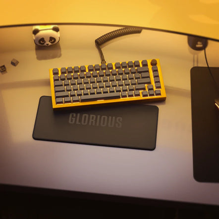 a keyboard on a glass table